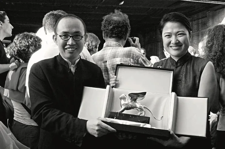 Pan Shiyi and Zhang Xin share an award for patronage of architecture at the 2002 Venice Biennale.