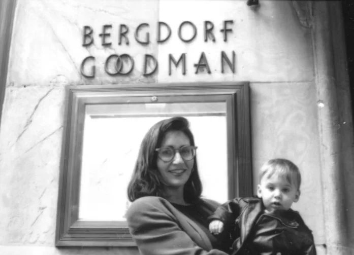 Brown, holding her son Dylan Plofker, the day her first lipsticks launched at Bergdorf Goodman.