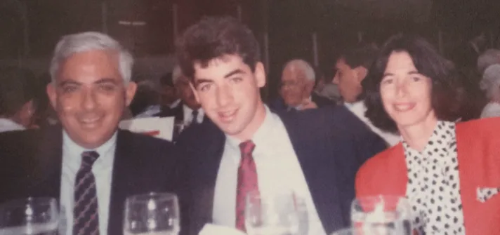 Ackman as a young man with his parents, Larry and Ronnie.